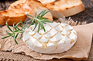 Baked Camembert cheese with rosemary and toast