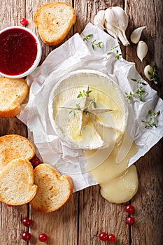 Baked camembert cheese with thyme and garlic served with roasted