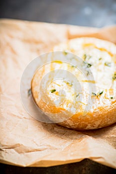 Baked camembert cheese with thyme on the rustc background photo