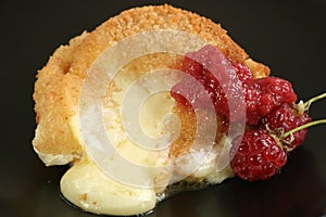 Baked camembert with raspberry coulis photo