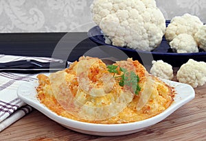 Baked Cauliflower in a creamy cheddar cheese sauce.
