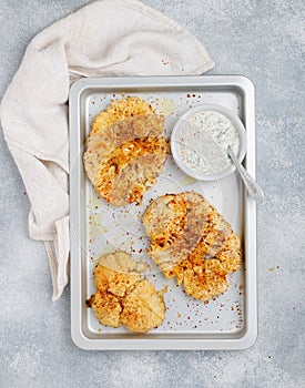 Baked cauliflower steaks with herbs and spices