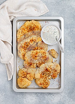 Baked cauliflower steaks with herbs and spices