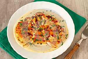 Baked cauliflower steaks with herbs and spices and tahini sauce