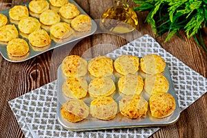 Baked cheese bread called chipa in baking tray photo