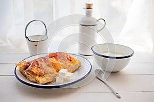 Banitsa with cheese and yogurt for breakfast. Traditional bulgarian snack. photo