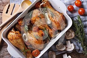 Baked Chicken drumsticks with vegetables closeup horizontal top