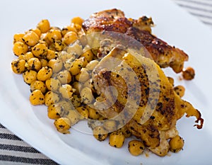 Baked chicken thighs with garbanzos photo