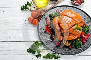 Baked chicken with vegetables and cranberries. Festive traditional food. Thanksgiving day. Top view