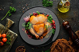 Baked chicken with vegetables and cranberries. Festive traditional food. Thanksgiving day. Top view.