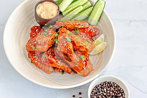 Baked Chicken Wings with Dip and Cucumber Horizontal Photo