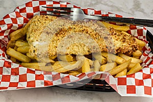 baked cod sered with a side of fries