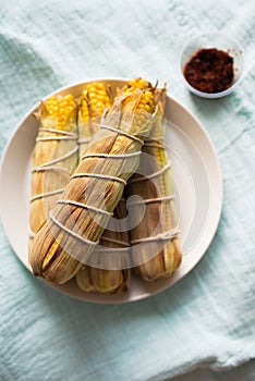 Baked corn with chili sauce