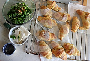 Baked croissants with herb salad and cottage cheese