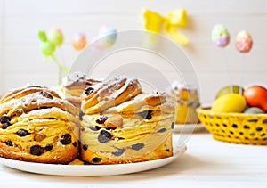 Baked Easter cakes with colored eggs. Easter card with easter baked goods and decor