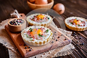 Baked egg and bacon tartlets