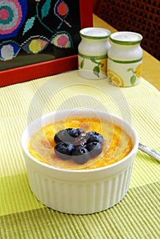 Baked egg custard, blue berries, jam