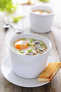 Baked egg with mushrooms and toast