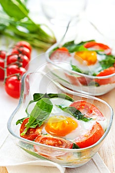Baked egg with tomatoes and spinach