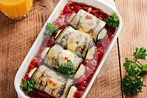 Baked eggplant with tomato sauce and cheese roll