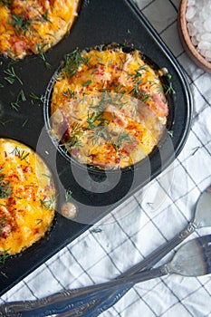 Baked eggs with sausage, cheese and dill