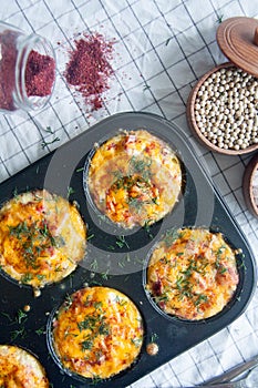 Baked eggs with sausage, cheese and dill