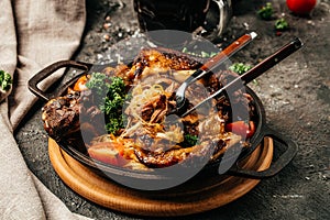 Baked Eisbein with sauerkraut and beer. Roasted knuckle of pork. German cuisine, Oktoberfest