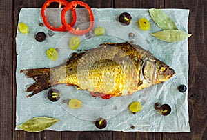 Baked fish carp, stuffed bell peppers and grapes