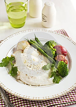 Baked fish fillet served with broccoli, green bean and potato