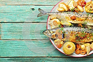 Baked fish mackerel wooden table
