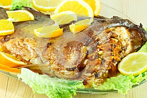 Baked fish stuffed with vegetables