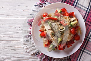 Baked flounder with seasonal vegetables. horizontal top view