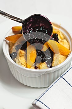 Baked french toast with peaches and blueberries