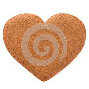 Baked gingerbread from shortbread in the form of a heart. Isolated on white background.