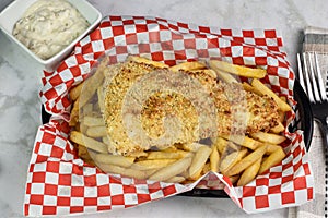 baked haddoc on fries with tarter sauce photo