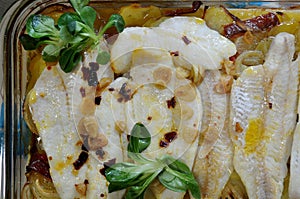 Baked hake with potatoes
