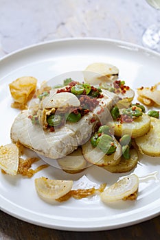 Halibut with baby potatoes, broad beans and chorizo
