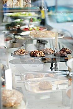 Baked healthy cookies in a vitrine of a cafe photo