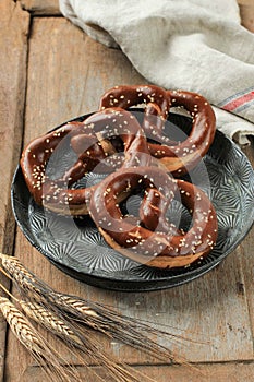 Baked Homemade Soft Pretzel Bavarian Brezel with Salt on Rustic Table