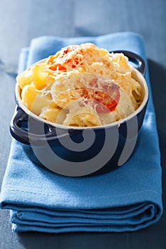 Baked macaroni with cheese in blue casserole