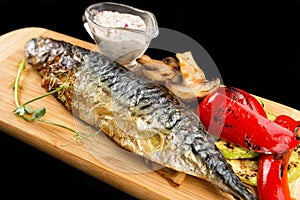 Baked mackerel fish with grilled vegetables and mushrooms