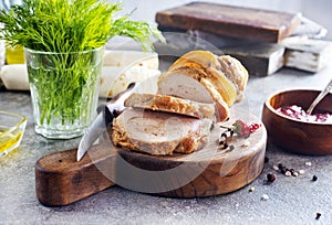 baked meat roll with spice on wooden board