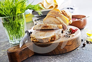 baked meat roll with spice on wooden board