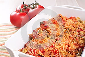 Baked meat and vegetables casserole with cheese