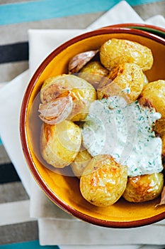 Baked new potatoes with sauce
