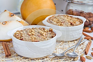 Baked oatmeal with nuts, almond milk, spices and asian pear