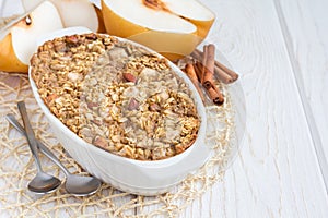 Baked oatmeal with nuts, almond milk, spices and asian pear