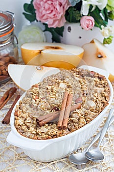 Baked oatmeal with nuts, almond milk, spices and asian pear
