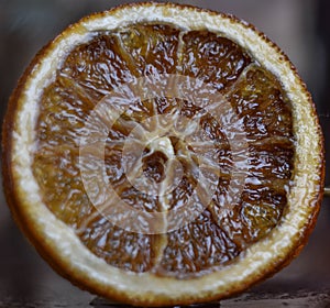 Baked orange, sluggish orange, sweet baked in oven round orange slice, orange macro photo