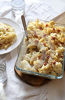 Baked pasta with cauliflower, bacon and parmesan cheese.